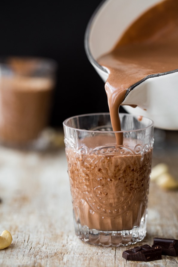 hot chocolate pouring into a glass